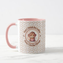 Cute baby monkey holds a steamy hot coffee