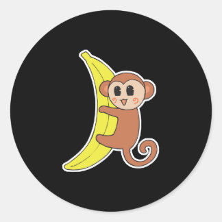 cute baby monkey on banana classic round sticker