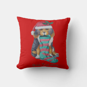 cute black and brown puppy with christmas stocking cushion