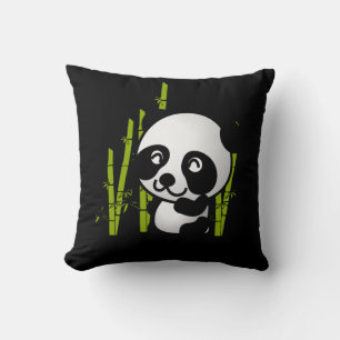 Cute black and white panda bear in a bamboo grove. cushion