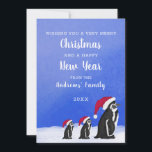 Cute Blue Red Penguin Santa Family Snowy Christmas Holiday Card<br><div class="desc">This cute and adorable Christmas holiday greeting card will surely invoke the festive feels with your guests. It features a hand-painted watercolor illustration of a black and white family of penguins all wearing a red and white Santa Clause hat with a little one trailing behind on the back of the...</div>