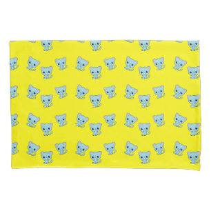 Cute bouncy blue kitten on yellow pillowcase