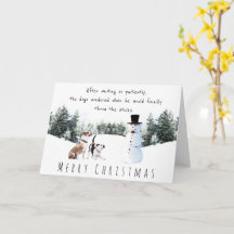 Cute boxer dogs play with snowman merry christmas