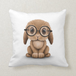 Cute Brown Baby Bunny Wearing Glasses on White Cushion