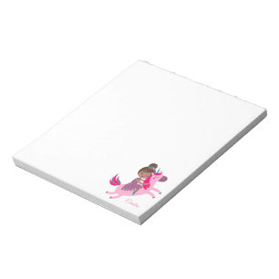 Cute Brunette Haired Girl Riding on a Unicorn Notepad