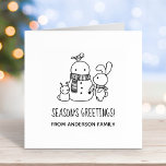 Cute Bunny Rabbit and Snowman Seasons Greetings  Rubber Stamp<br><div class="desc">Cute cartoon rabbit is adding a carrot nose to a snowman. The snowman is already sporting a lovely knitted scarf. A tiny bunny-shaped snowman and a bird complete the picture. Customisable text.</div>