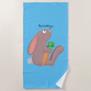 Cute bunny rabbit sitting with carrot cartoon beach towel