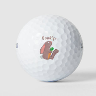 Cute bunny rabbit sitting with carrot cartoon golf balls