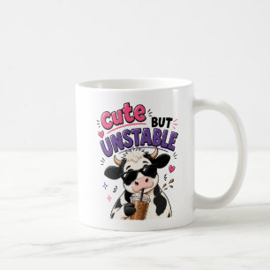 Cute but unstable cow with iced coffee mug