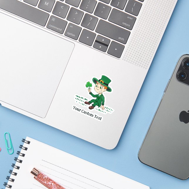 Cute cartoon leprechaun with shamrock and rainbow (Laptop w/ iPhone)