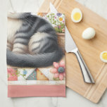 Cute Cat on Floral Quilt Cottagecore Tea Towel<br><div class="desc">A delightful gray tabby kitten sits sweetly among blooming flowers in this cozy, cottagecore-inspired design. The backdrop features a vibrant patchwork quilt filled with charming geometric patterns, soft pastels, and vintage textures that evoke feelings of warmth and nostalgia. Surrounding the kitten are blooming sunflowers, roses, and daisies, along with cheerful...</div>