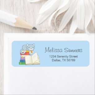 Cute Cat on top of a Book Stack on Blue