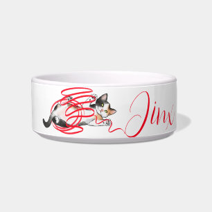 Cute Cat Playing with a Ribbon Bowl