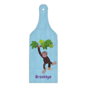 Cute chimpanzee in jungle hanging cartoon cutting board