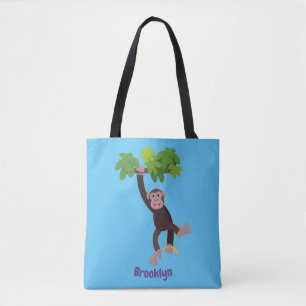 Cute chimpanzee in jungle hanging cartoon tote bag