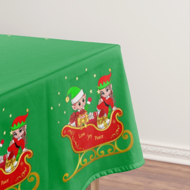Cute Christmas elves on sleigh on green Tablecloth (In Situ)
