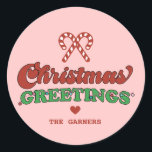 Cute Christmas Greetings Retro Classic Round Sticker<br><div class="desc">Make this Christmas extra special with our retro-inspired "Christmas Greetings" round sticker. This delightful design is the perfect way to add a touch of christmas charm to your gifts and packagings. You can easily add a custom name to make this sticker personal and special. Featuring playful typography and vibrant colours,...</div>