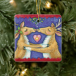 Cute Christmas Reindeer, Romantic Kiss w Mistletoe Ceramic Tree Decoration<br><div class="desc">Vintage illustration Merry Christmas design featuring a love and romance design with two adorable reindeer kissing under the mistletoe. A heart is between them. A funny,  silly and romantic cartoon design for animal lovers.</div>