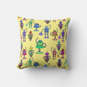 Cute colorful robots on yellow background cushion