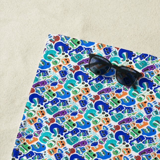 Cute colourful monsters face patterns beach towel (In Situ)