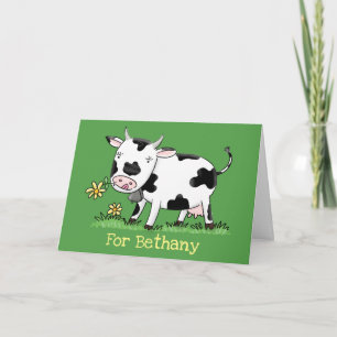 Cute cow in green field cartoon illustration card