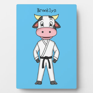 Cute cow in kung fu suit cartoon plaque