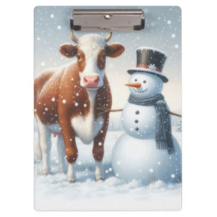 Cute cow & snowman in the winter field clipboard