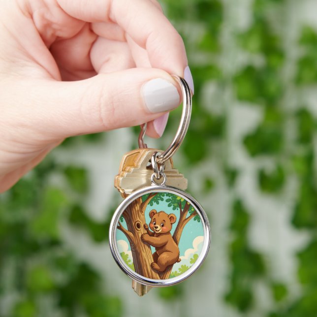 Cute cub bear climbing a tree key ring (Hand)