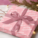 Cute December Winter Season Holiday Wordart Wrapping Paper<br><div class="desc">Cute white coloured Christmas holiday Merry Christmas wordart text pattern design on a classic light blush coral pink background colour. Vintage,  funky,  modern hipster designs for the lover of winter and December holiday themes. Fun paper sheets for wrapping those fun December surprise gifts or Christmas presents with.</div>