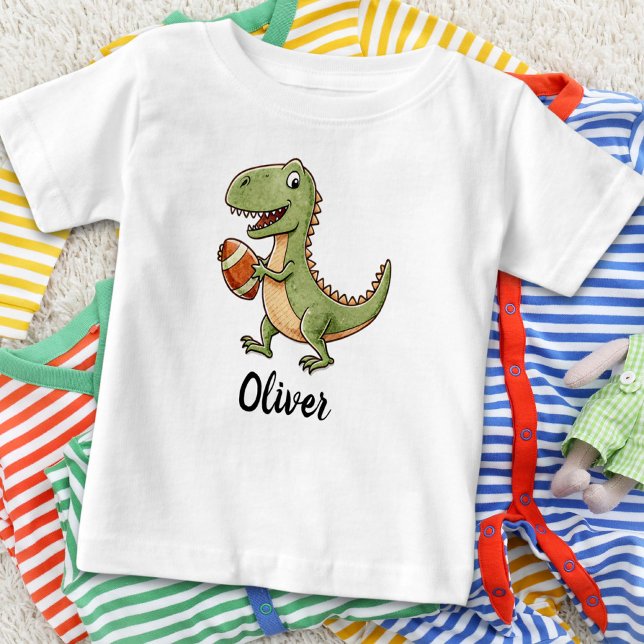 Cute Dinosaur Playing Football Baby T-Shirt (Creator Uploaded)