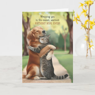 Cute Dog and Cat Hugging in a Park Birthday Hugs Card