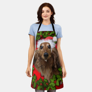 Cute dog with Santa's red hat and garland Apron