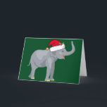 Cute Elephant Christmas in Santa Hat Holiday Card<br><div class="desc">Cute holiday animals are my favourite part of Christmas. A beautiful grey elephant wearing a red Santa hat and looking happy on a festive green background. This fills me with the Christmas spirit.</div>
