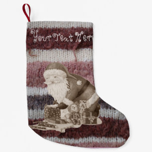 Cute father christmas wrapping gifts knitted small christmas stocking