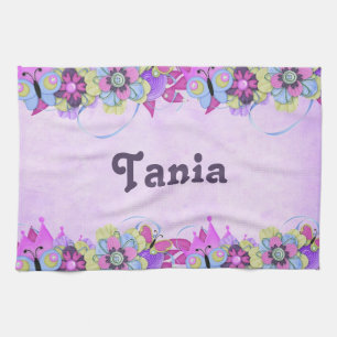 Cute flowers and butterflies on purple tea towel