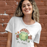 Cute Frog and Mushrooms Be Hoppy Cartoon  T-Shirt<br><div class="desc">This cute T-shirt features a hand-drawn kawaii style cartoon frog, wearing a mushroom hat, along with other mushrooms, a snail, a flower, a butterfly, and grass. A colour scheme of red, lime, green, brown, orange, yellow, and peach is perfect for either the Indie or Cottage Core Aesthetic lover. Customise the...</div>