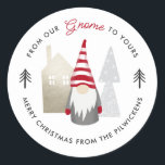 Cute From our Gnome to Yours Christmas   Classic Round Sticker<br><div class="desc">These fun stickers feature a gnome, wearing a red and white striped hat. Other design elements include a house and trees, with an overal simple colour scheme of muted black, red, beige, grey, and white. Play-on-words text reads, "From our Gnome to yours, Merry Christmas... " Easy to personalise and great...</div>