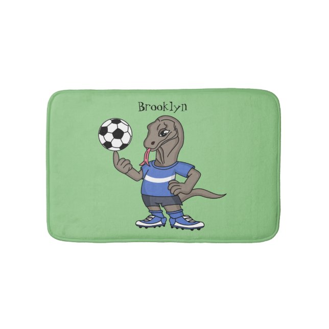 Cute funny Komodo dragon playing soccer cartoon Bath Mat (Front)
