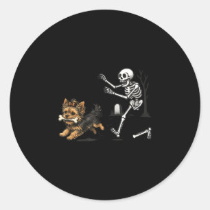 Cute funny skeleton chasing yorkie dog lovers classic round sticker