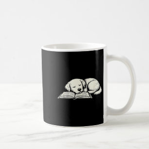 Cute golden retriever dog sleeping on book reader coffee mug