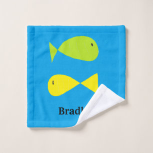 Cute green and yellow fishes on blue wash cloth