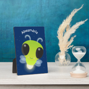 Cute green glow bug firefly cartoon illustration plaque