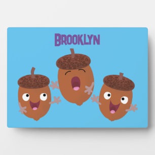 Cute happy acorns singing cartoon for kids plaque