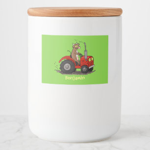 Cute happy cow driving a red tractor cartoon food label