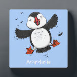 Cute happy flying puffin blue cartoon illustration plaque<br><div class="desc">This design features a cute,  happy puffin on a blue background in adorable cartoon illustration style. Lots of puffin fun!</div>