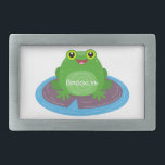 Cute happy green frog cartoon illustration belt buckle<br><div class="desc">This cute happy green frog sitting on a purple lily pad is bright and adorable. Lots of amphibian fun drawn in happy cartoon style.</div>