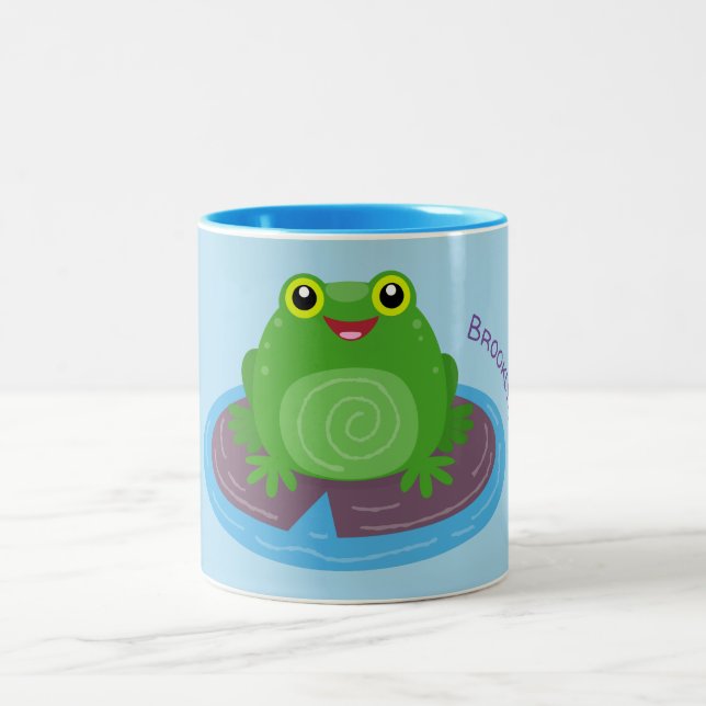 Cute happy green frog cartoon illustration Two-Tone coffee mug (Center)
