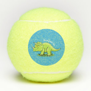 Cute happy green triceratops dinosaur cartoon tennis balls