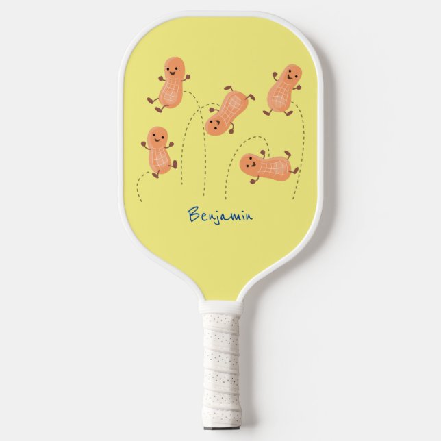 Cute happy jumping peanuts cartoon illustration pickleball paddle (Front)