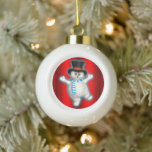 Cute Happy Snowman on Red Christmas Ceramic Ball Christmas Ornament<br><div class="desc">This Christmas cutie will be sure to add some fun and colour to your Christmas tree for the holidays. The ornament features a sweet little snowman, very happy that it's Christmas again, obviously! He's wearing a black top hat and a striped blue and white scarf. Behind him is a colourful...</div>